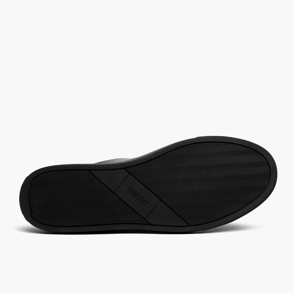 High-Traction Rubber Outsole & Lug Tread Pattern on Encore Jet Musta Nahkatennarit Miehille