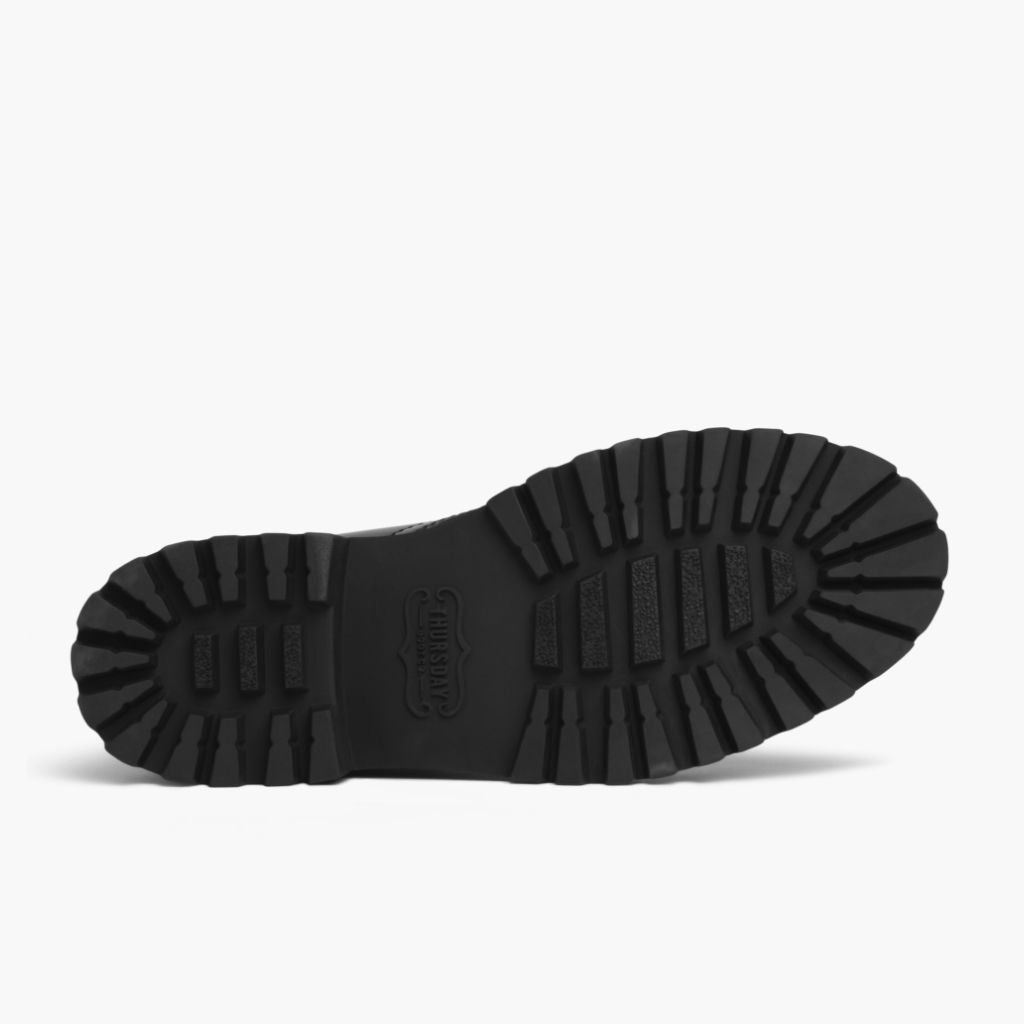 High-Traction Rubber Outsole & Lug Tread Pattern on Captain Musta (StormKing®) Nahkasaappaat Naisille