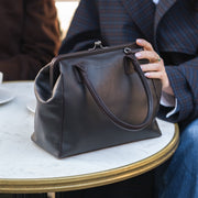 Styled Fit Perspective of Dorin Full-Grain Leather Handbag Naisille on Model - Natural Daylight Drape