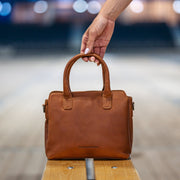Styled Fit Perspective of Hermosa Full-Grain Leather Handbag Naisille on Model - Natural Daylight Drape