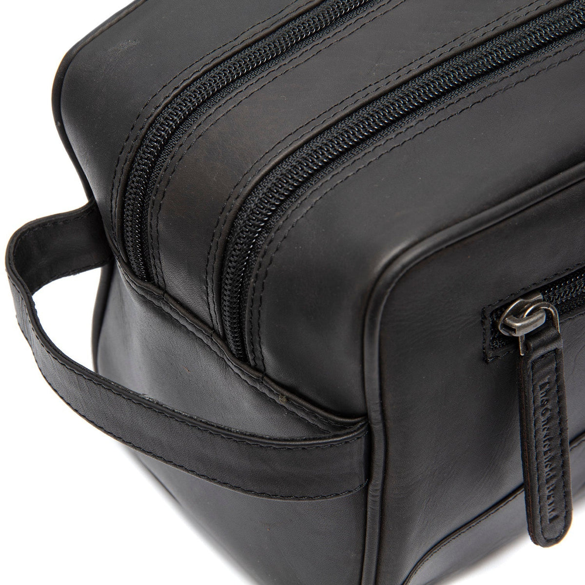 Close-Up Detail of Classic Collar &amp; Heavy-Duty Zipper Hardware on Stacey Full-Grain Leather Toiletry Bag Naisille