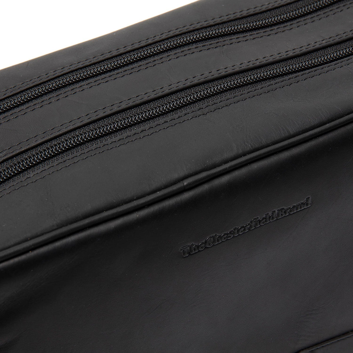 Close-Up Detail of Classic Collar &amp; Heavy-Duty Zipper Hardware on Stefan Full-Grain Leather Toiletry Bag Naisille