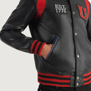 
Yksityiskohtainen lähikuva of Varsity & Snap Button Hardware on Liberte USA Black Leather Varsity Jacket