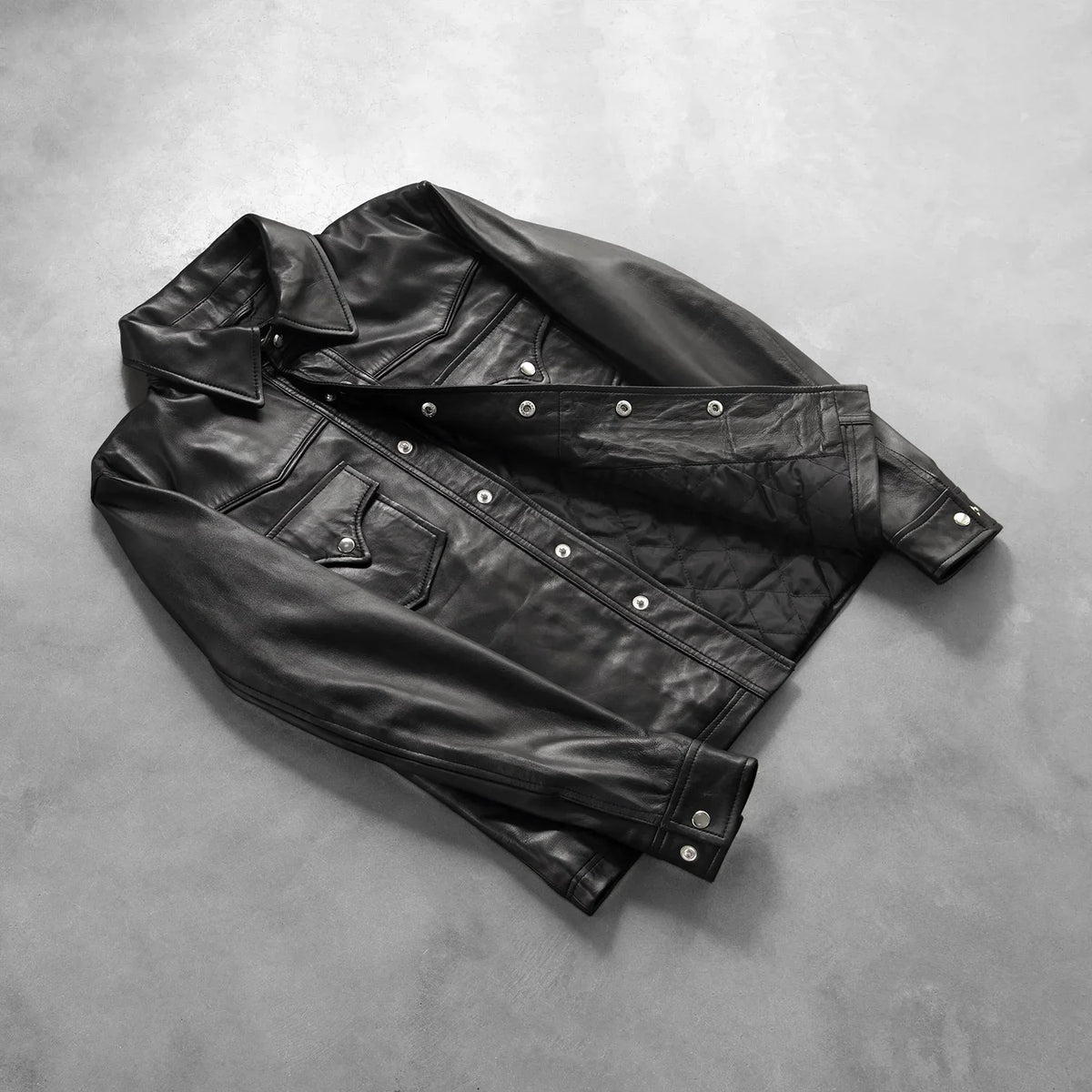 
Button & Hem Craftsmanship Construction Detail on Ranchson Musta Leather Shirt Miehille
