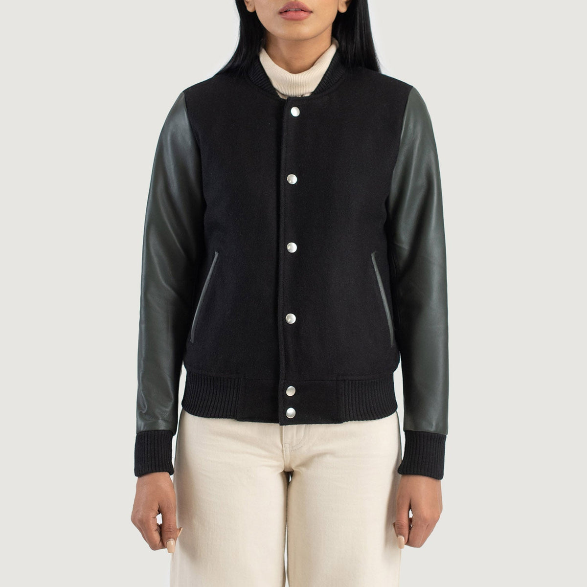 
Yksityiskohtainen lähikuva of Varsity & Snap Buttons Hardware on Savant Green Hybrid Varsity Jacket